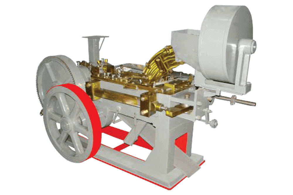 AUTOMATIC BOLT HEAD TRIMMING AND SHANK REDUCING MACHINE