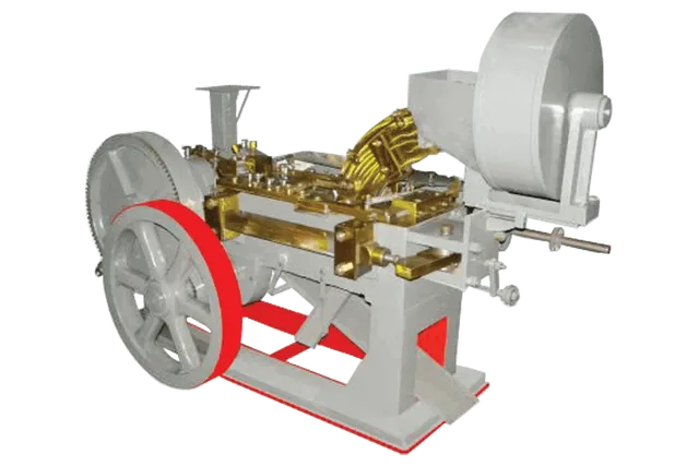 AUTOMATIC BOLT HEAD TRIMMING AND SHANK REDUCING MACHINE