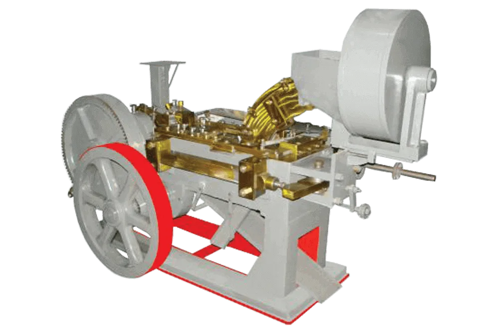 AUTOMATIC BOLT HEAD TRIMMING AND SHANK REDUCING MACHINE